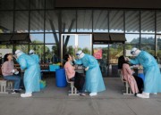 Picture of medical staff performing COVID tests