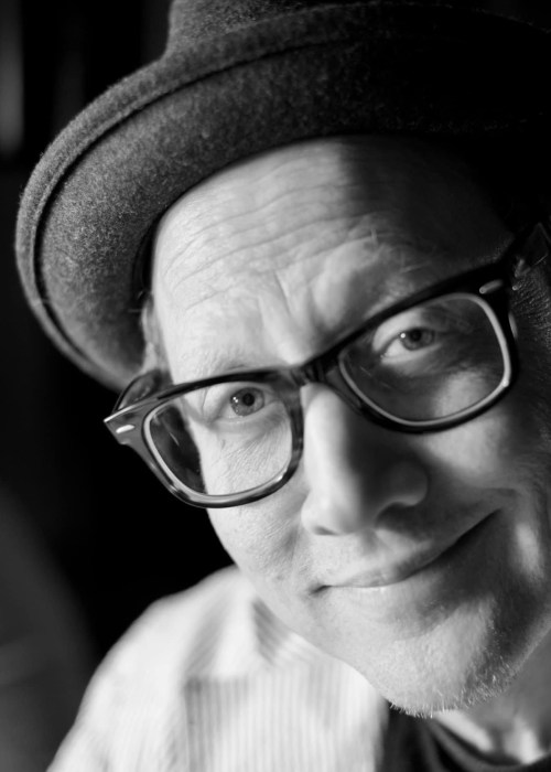 black and white photo of author and comedian Rob Schneider